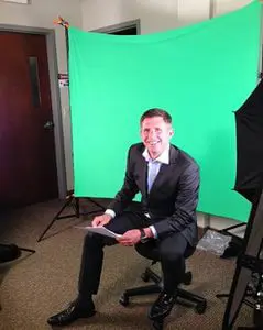 William Wiley MD in front of a green screen